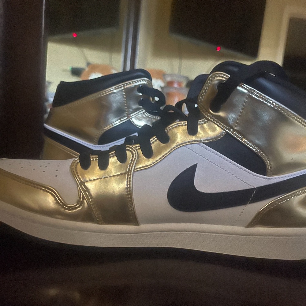 Jordan 1s black , gold ,and white